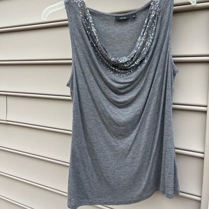 Womens sleeveless top with sequined scoop neckline. Excellent condition.